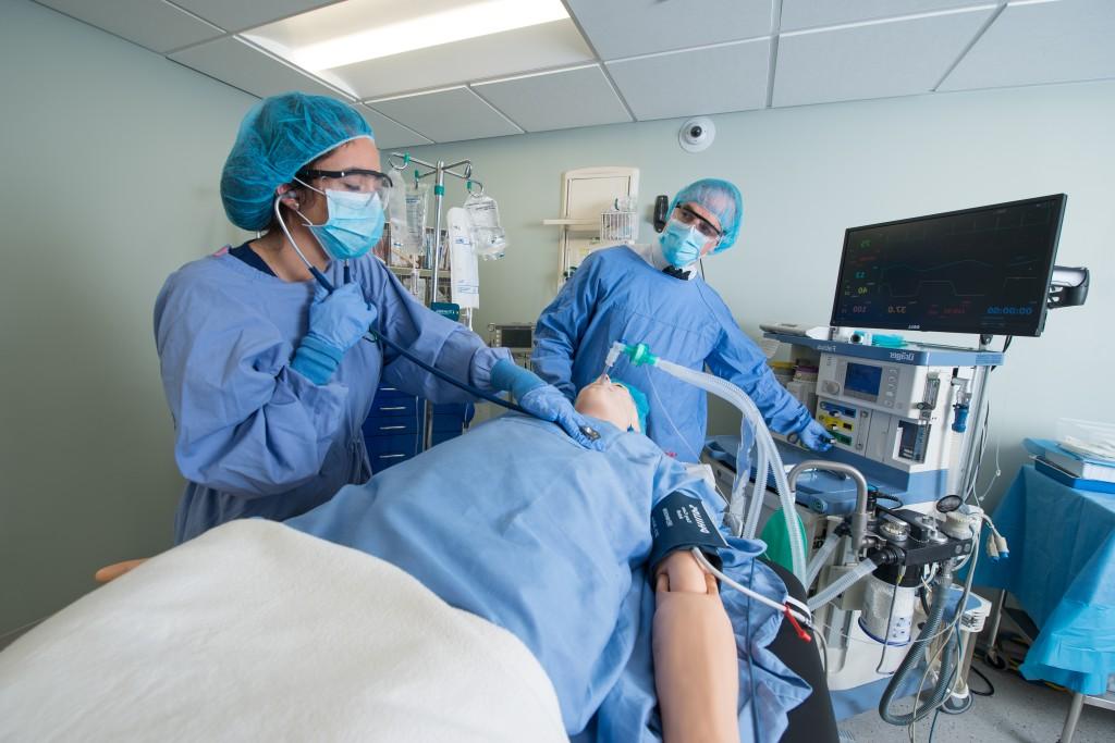 Image of nursing students tending to simulation patient